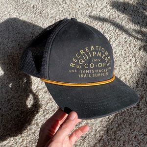 REI black rope trucker hat